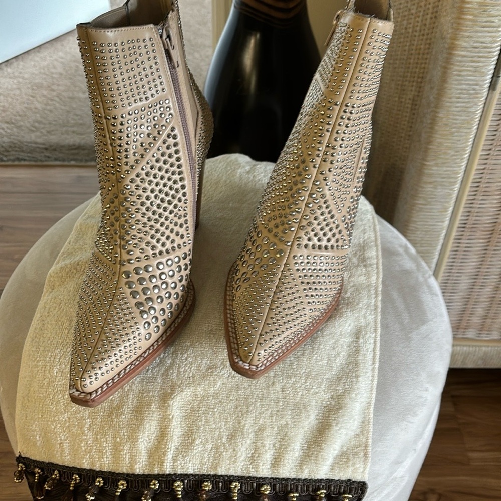 pair of shot booties with rhinestones all over them